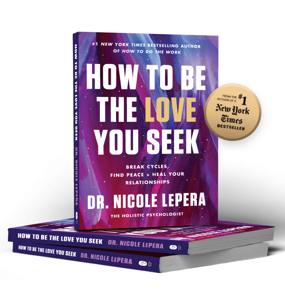 A stack of How to Be the Love You Seek by Dr. Nicole LePera, the top copy standing upright to show its cover